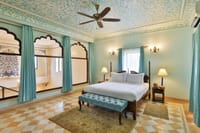 Twin beds in a suite with arched alcoves