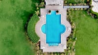 Aerial view of the 60x60 ft swimming pool set in lawns