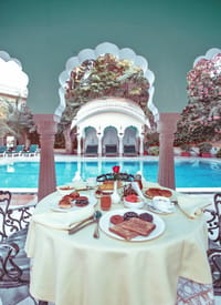 A table set beside the pool