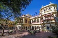 Haveli facade and courtyard cafe tables