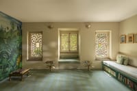 Library with hand-painted wall art and latticed windows