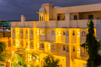 Vasant Vilas facade lit at dusk