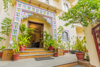 Hand-painted arched entrance with plants