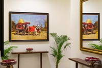 Gallery corridor with artwork and console tables