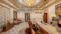 Reception lobby with chandelier and painted ceiling