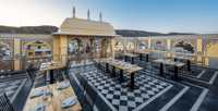 Rooftop dining terrace with views of the surrounding hills