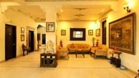 Sitting hall with murals and traditional furniture
