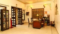 Lobby corner with writing desk and mural wall