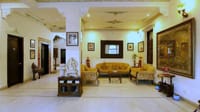 Sitting hall with murals and traditional furniture