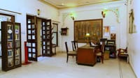 Lobby corner with writing desk and mural wall