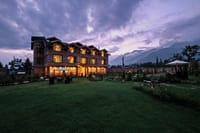Nadis at dusk, the house and its garden under the Zabarwan hills