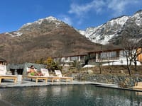 Qayaam Gah pool with snow on the Zabarwan hills