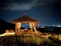 Qalb gazebo at night above the lights of Srinagar
