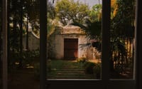 Garden gateway seen through a window
