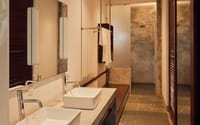 Bathroom with twin basins and stone shower