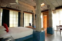 Granite Suite bedroom with stone pillars