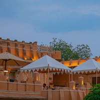 Vintage tents behind a garden wall