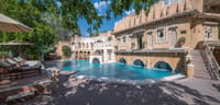 Swimming pool below the arcaded palace