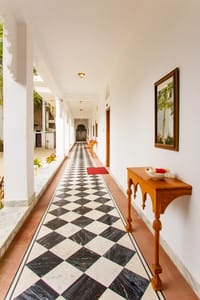 Corridor floored in black and white marble