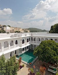 Courtyard pool below arcades with the lake beyond