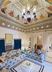 Suite under a painted and gilded ceiling