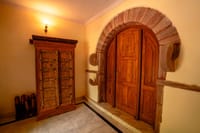 Carved wooden door in a stone arch