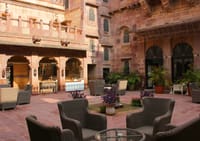 Seating in the sandstone courtyard