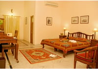 Deluxe room with dark wood furniture