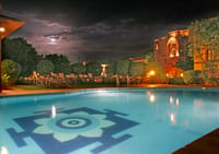 Pool at night with lotus floor motif