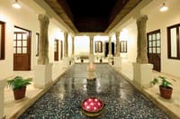 Pillared hall with inlaid floor and rangoli