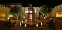 Courtyard shrine lit at night