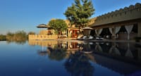 Infinity pool reflecting the fort