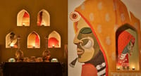 Lamp niches beside a painted mural