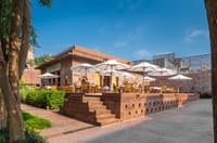 Baradari terrace with parasols and sandstone walls