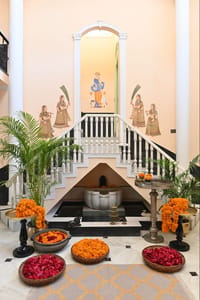 Painted entrance hall with marigolds and staircase