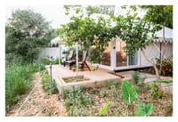 Tented cottage on a raised deck in grassland