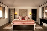 Bed under a tented ceiling