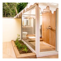 Open-to-sky shower and planted bathroom