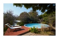 Round plunge pool with loungers
