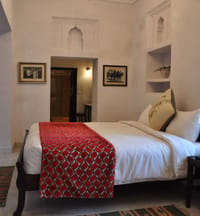 Heritage room bed with red runner