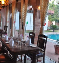 Laid table beside the pool