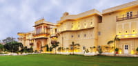 Palace facade above lawn in daylight