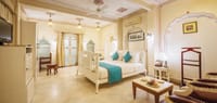 Suite bedroom with white walls