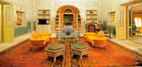 Sitting room with orange chairs and carpet