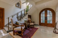 Lobby with staircase and armchairs
