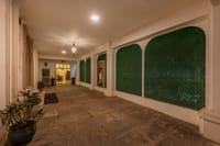 Corridor with green latticed arches