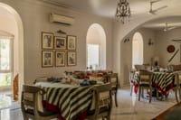 Dining room with arches and picture wall