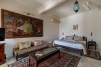 Room with large painting and low sofa