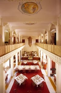 Restaurant interior with painted ceiling medallion