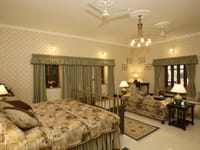 Deluxe room with sofa and chandelier